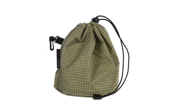 A Medium, clear-bottomed Yarn Stuff Sack in Taiga (olive green with white grid) 200 Halcyon.